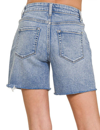 Plus Mid Rise Raw Hem Denim Shorts